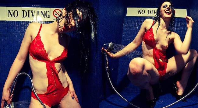 swimsuit dominatrix smiles while stripping